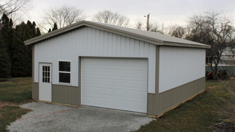 Small shed built as a pole barn makes a perfect garage!
