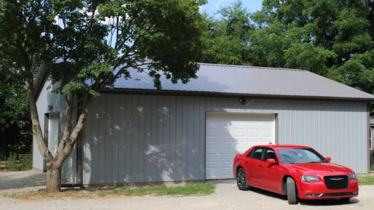 Gray Shed With Red Car