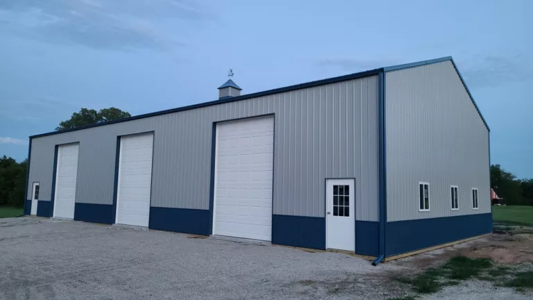 Large Gray Pole Barn With 3 Garage Doors